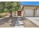 Charming home featuring a well-maintained front yard, inviting entrance, and a convenient two-car garage at 6329 Orange Hue St, North Las Vegas, NV 89031