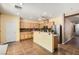 Eat in kitchen with a large island, stainless steel appliances, and plenty of cabinet space at 6329 Orange Hue St, North Las Vegas, NV 89031