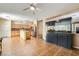 Bright, open-concept kitchen with stainless steel appliances, tile flooring, and a kitchen island at 6329 Orange Hue St, North Las Vegas, NV 89031