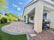 Outdoor patio with pavers, landscaping and a built in grill at 640 House Blend Ln, Henderson, NV 89052