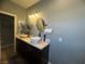 Dual vessel sinks and granite countertops add a modern touch to this bright bathroom at 640 House Blend Ln, Henderson, NV 89052
