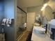 Bright bathroom with double sinks, granite countertop, and a spacious walk-in shower at 640 House Blend Ln, Henderson, NV 89052