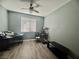 This bedroom has wood floors and is a blank slate, bathed in natural light at 640 House Blend Ln, Henderson, NV 89052