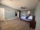 Large bedroom featuring wood-look floors, ample closet space, and neutral wall color at 640 House Blend Ln, Henderson, NV 89052