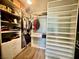 Walk-in closet with custom shelving and ample storage space for clothes, shoes, and accessories at 640 House Blend Ln, Henderson, NV 89052