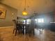 Comfortable dining area with chandelier and neutral-toned walls at 640 House Blend Ln, Henderson, NV 89052