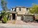 Lovely two-story home features a tile roof, stone accents, and a three-car garage at 640 House Blend Ln, Henderson, NV 89052