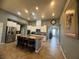 Spacious kitchen featuring white cabinetry, granite countertops, and stainless steel appliances at 640 House Blend Ln, Henderson, NV 89052
