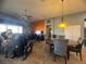 Relaxing living space with a dining area featuring a unique hanging light fixture at 640 House Blend Ln, Henderson, NV 89052