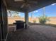 Spacious covered patio with a grill, brick pavers, and manicured landscaping at 640 House Blend Ln, Henderson, NV 89052