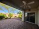 Relax on this covered brick patio that looks out to a lush, landscaped yard at 640 House Blend Ln, Henderson, NV 89052