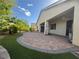 The backyard features a brick patio, well maintained landscaping, and an inviting outdoor living space at 640 House Blend Ln, Henderson, NV 89052
