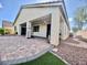 Enjoy this outdoor area with a covered patio with brick flooring and lush landscaping, great for relaxing at 640 House Blend Ln, Henderson, NV 89052
