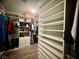 Spacious walk-in closet with custom shelving, drawers and hanging space, offering ample storage and organization at 640 House Blend Ln, Henderson, NV 89052