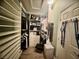 Bright walk-in closet features organized storage solutions and ample shelving for all your wardrobe needs at 640 House Blend Ln, Henderson, NV 89052