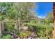 Fenced backyard featuring lush greenery and well-maintained landscaping at 6409 Sea Swallow St, North Las Vegas, NV 89084