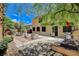 Backyard with patio seating area, BBQ, hot tub, and lush landscaping at 6409 Sea Swallow St, North Las Vegas, NV 89084