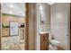 Bathroom access from kitchen includes cabinet, sink and toilet at 6409 Sea Swallow St, North Las Vegas, NV 89084