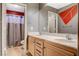 Bathroom featuring a double vanity and a shower with a gray curtain at 6409 Sea Swallow St, North Las Vegas, NV 89084