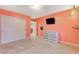 Bedroom featuring carpet, closet, and wall-mounted television at 6409 Sea Swallow St, North Las Vegas, NV 89084