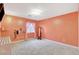 Bright bedroom with carpet, window with pink curtains, and wall-mounted decor at 6409 Sea Swallow St, North Las Vegas, NV 89084