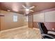Functional bonus room featuring hardwood floors, custom shelving, and barn door access at 6409 Sea Swallow St, North Las Vegas, NV 89084