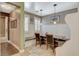 Charming breakfast nook featuring travertine floors, custom bench seating, and natural light at 6409 Sea Swallow St, North Las Vegas, NV 89084