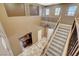 Spacious foyer showcasing staircase, tiled flooring, and views of the upper loft at 6409 Sea Swallow St, North Las Vegas, NV 89084