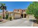 Spacious two-story home with desert landscaping, a tile roof, and a driveway leading to the attached two-car garage at 6409 Sea Swallow St, North Las Vegas, NV 89084