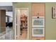Double oven and walk-in pantry maximize storage and cooking efficiency in this kitchen at 6409 Sea Swallow St, North Las Vegas, NV 89084