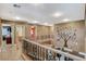 Loft area with decorative tree wall decal, wood-look flooring, and staircase views at 6409 Sea Swallow St, North Las Vegas, NV 89084