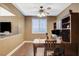 Well-lit office with hardwood floors, custom built-in shelving, and views into the living room and foyer at 6409 Sea Swallow St, North Las Vegas, NV 89084