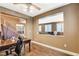 Office space with hardwood floors and built-in desk, open to the living room and adjacent to the staircase at 6409 Sea Swallow St, North Las Vegas, NV 89084