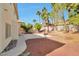 This backyard boasts a concrete patio, gravel, and a basketball hoop at 6509 Alpine Winter Ct, Las Vegas, NV 89149
