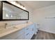 Elegant bathroom with double sinks, marble countertops, ample storage space, and modern fixtures at 6509 Alpine Winter Ct, Las Vegas, NV 89149