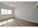 Bedroom features hardwood floors and natural light at 6509 Alpine Winter Ct, Las Vegas, NV 89149