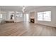 Bright living space with wood-look floors, a fireplace, access to the kitchen and outdoor access at 6509 Alpine Winter Ct, Las Vegas, NV 89149