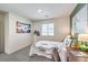 Bright bedroom featuring soccer-themed decor, a desk area, and ample natural light at 6533 Cinnamon Hazelnut St # Lot 94, North Las Vegas, NV 89084