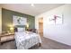 Bright bedroom featuring soccer-themed decor, a desk area, and access to a walk-in closet at 6533 Cinnamon Hazelnut St # Lot 94, North Las Vegas, NV 89084