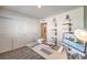 Bedroom view featuring a glass desk with modern computer and shelving with decorative boxes at 6533 Cinnamon Hazelnut St # Lot 94, North Las Vegas, NV 89084