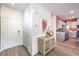 Inviting foyer features sleek flooring, a stylish console table, and an adjacent kitchen at 6533 Cinnamon Hazelnut St # Lot 94, North Las Vegas, NV 89084