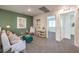 Inviting loft space featuring seating, artwork, and natural light, creating a versatile and comfortable area at 6533 Cinnamon Hazelnut St # Lot 94, North Las Vegas, NV 89084
