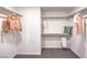 Spacious walk-in closet with shelving and hanging rods for ample storage at 6533 Cinnamon Hazelnut St # Lot 94, North Las Vegas, NV 89084