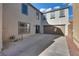Spacious backyard with a patio area and access to the garage, perfect for outdoor activities at 680 Moonlight Stroll St, Henderson, NV 89002