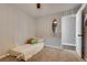 Bedroom featuring a twin bed, decorative mirror, and an open door at 680 Moonlight Stroll St, Henderson, NV 89002