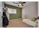 Bedroom featuring one window, a ceiling fan, and a twin-size bed at 680 Moonlight Stroll St, Henderson, NV 89002