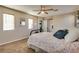 Bedroom featuring carpet flooring, neutral walls, and a ceiling fan at 680 Moonlight Stroll St, Henderson, NV 89002