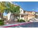 Charming two-story home featuring well-maintained landscaping and a welcoming front porch at 680 Moonlight Stroll St, Henderson, NV 89002