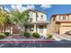 Charming two-story home featuring well-maintained landscaping and a welcoming front porch at 680 Moonlight Stroll St, Henderson, NV 89002