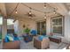 Inviting covered patio with string lights and comfortable outdoor seating at 680 Moonlight Stroll St, Henderson, NV 89002